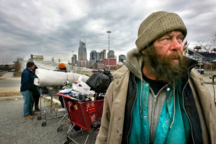 -  - Homeless man John Wayne and others wait in a parking lot near LP Field after Metro police had them move their possessions from under the Shelby Street Bridge. Wayne said police have been nice about giving them time to move. A recent count by a national organization found 1,542 homeless people living in Nashville in January 2005. -  -.JOHN PARTIPILO/THE TENNESSEAN